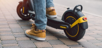 Person travelling on an e-scooter
